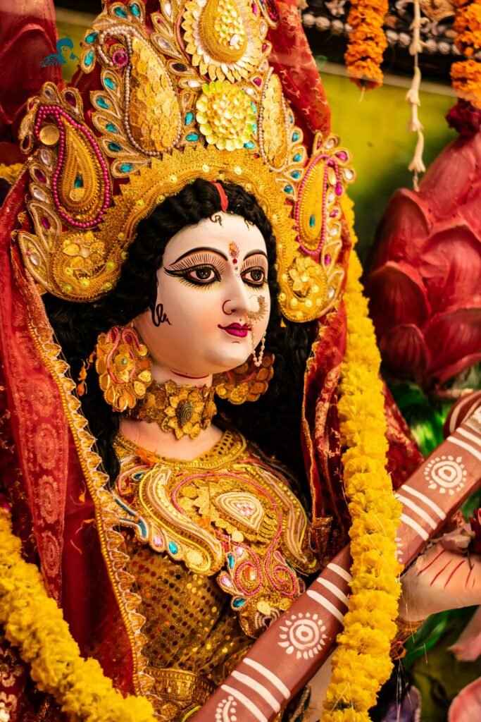 Vibrant idol of Goddess Durga adorned with colorful decorations during Navratri in India.